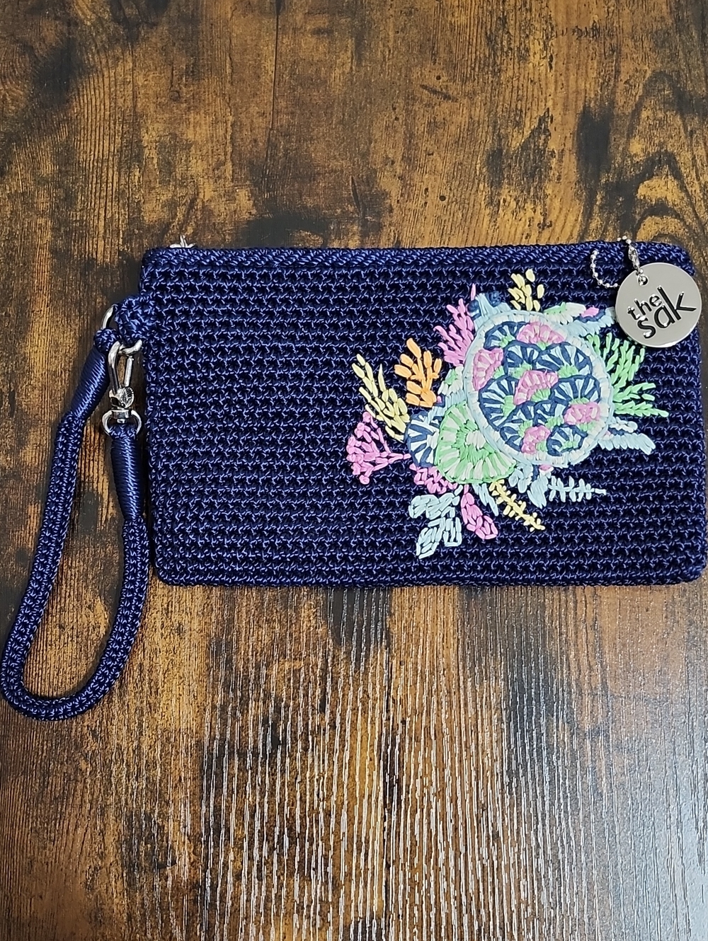 The Sak Navy Crochet Wristlet with Silver Logo Charm, NWT